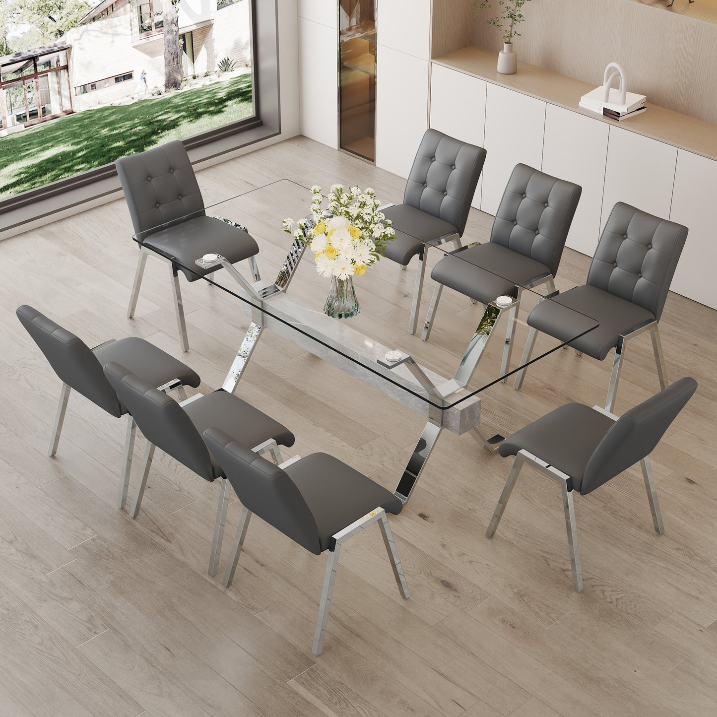 Table and chair set. 1 table and 8 grey chairs. Tempered glass desktop. Equipped with silver plated metal legs and MDF crossbars. Paired with armless soft backrest dining chairs. 1105 0809 - Enova Luxe Home Store